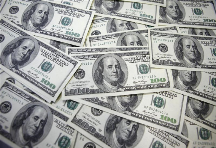 U.S. 100 dollar notes are seen at a bank in this picture illustration in Seoul U.S. 100 dollar notes are seen at a bank in this picture illustration in Seoul