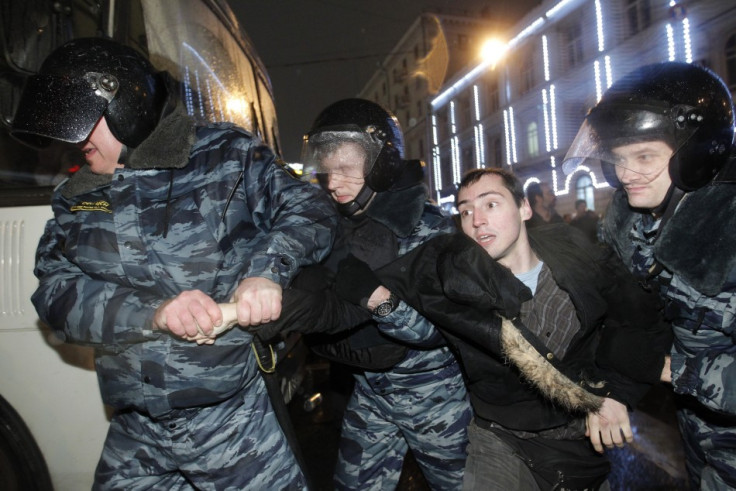 Russian police detain a participant during an opposition protest in central Moscow December 5, 2011