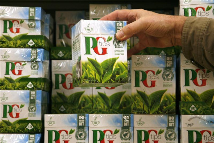 A shopper picks up a box of PG Tips tea bags at a Sainsbury&#039;s supermarket in London