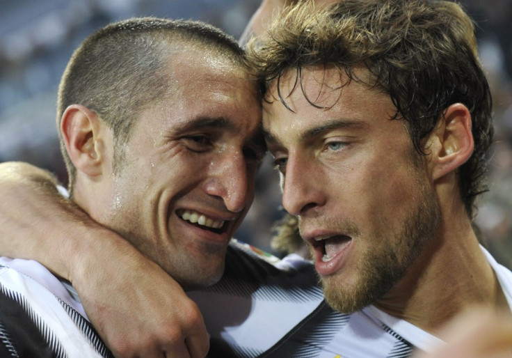 Juventus' Marchisio reacts with teammate Chiellini after scoring against Cesena during their Italian Serie A soccer match at the Arena stadium in Turin