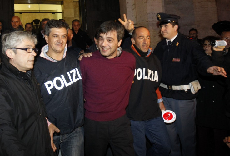 Italian policemen escort Camorra boss Antonio Iovine in 2010