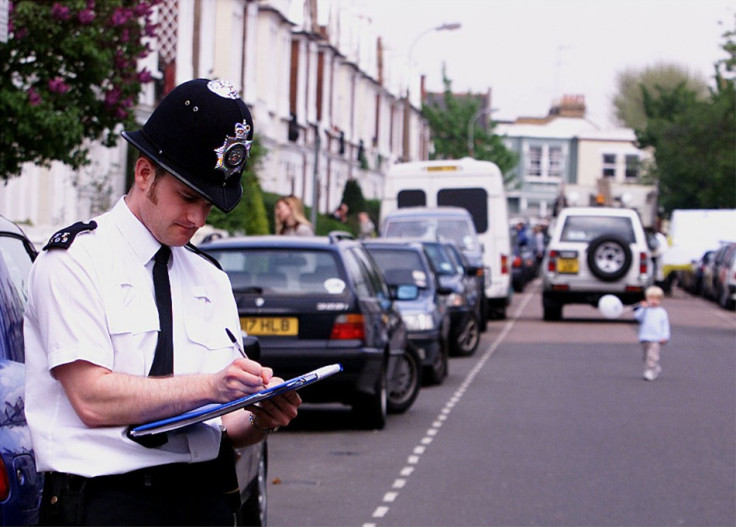 A Police Officer stands at West End Road , Central London