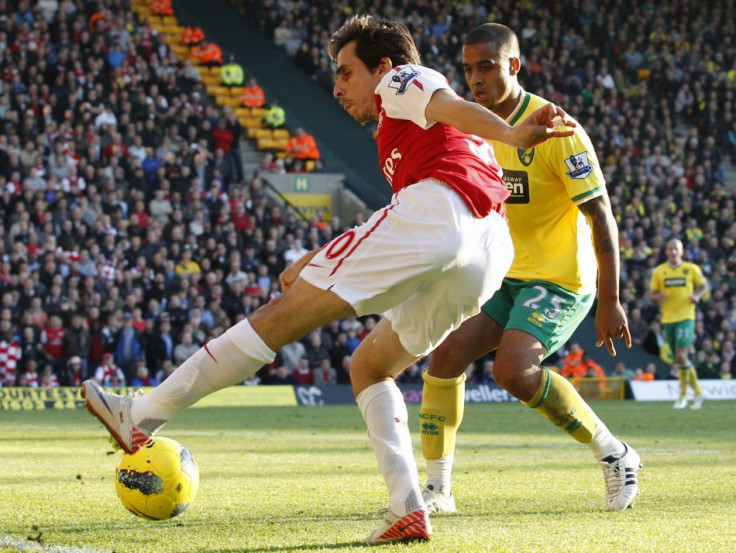 Norwich City's Naughton challenges Arsenal's Benayoun during their English Premier League soccer match at Carrow Road in Norwich
