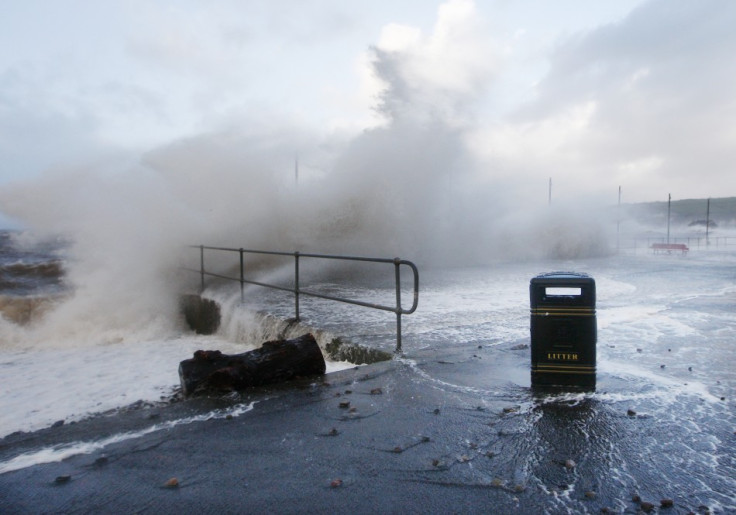 Waves crash against the promenade in Largs in west Scotland on Wednesday.