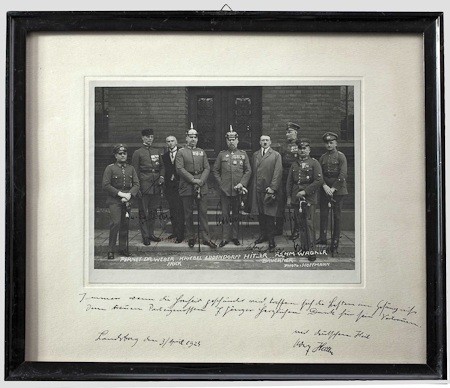 The photo shows Hitler with his eight fellow defendants standing on the court house steps. Six of the defendants have signed upon their respective images, including Wilhelm Frick, Friedrich Weber, Hermann Kriebel, Erich Ludendorff, Wilhelm Bruckner and E