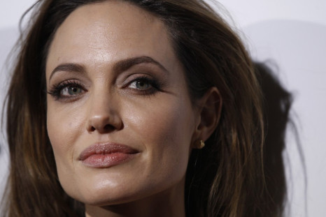 Director of the movie Angelina Jolie poses at the premiere of &quot;In the Land of Blood and Honey&quot; at the Arclight theatre in Los Angeles, California