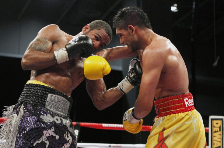 Lamont Peterson (L) and Amir Khan -December 10, 2011