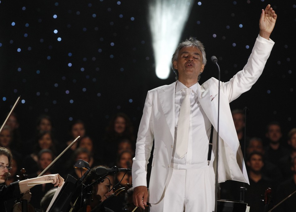 Italian tenor Bocelli waves to the crowd during his performance in New York
