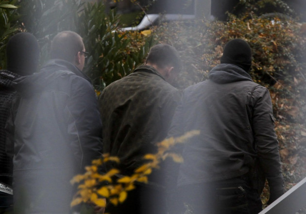 A suspected accomplice (C) of a neo-Nazi cell is escorted by police at the Bundesgerichtshof in Karlsruhe November A suspected accomplice (C) of a neo-Nazi cell is escorted by police at the Bundesgerichtshof in Karlsruhe November