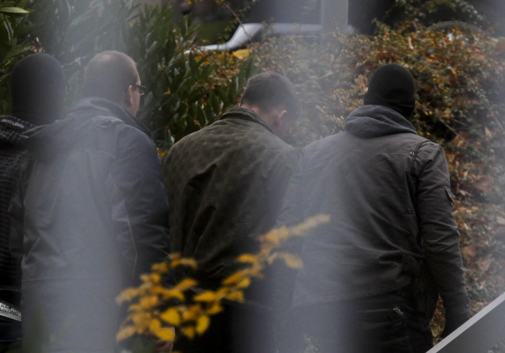 A suspected accomplice (C) of a neo-Nazi cell is escorted by police at the Bundesgerichtshof in Karlsruhe November