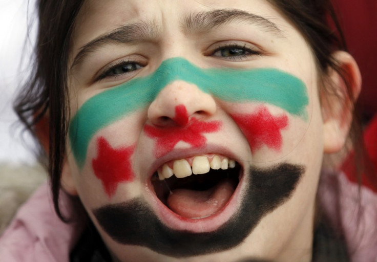 A Syrian girl living in Turkey shouts slogans as a group of Syrians protest against the government of Syria's President