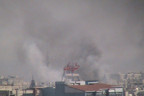 Smoke rises from the city of Homs