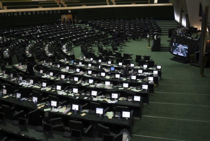 Member of Parliament Mostafa Kavakebian is seen on a screen as he speaks at the parliament in Tehran