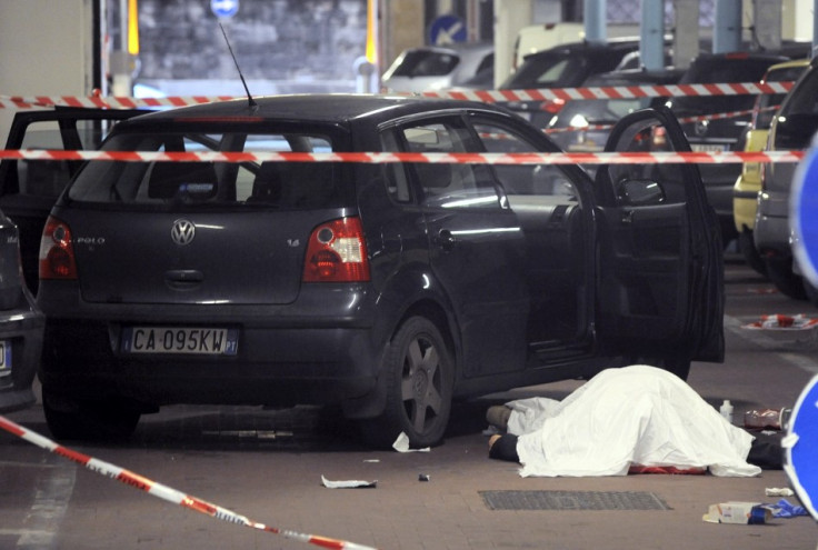 The body of Gianluca Casseri lies on the ground in Florence