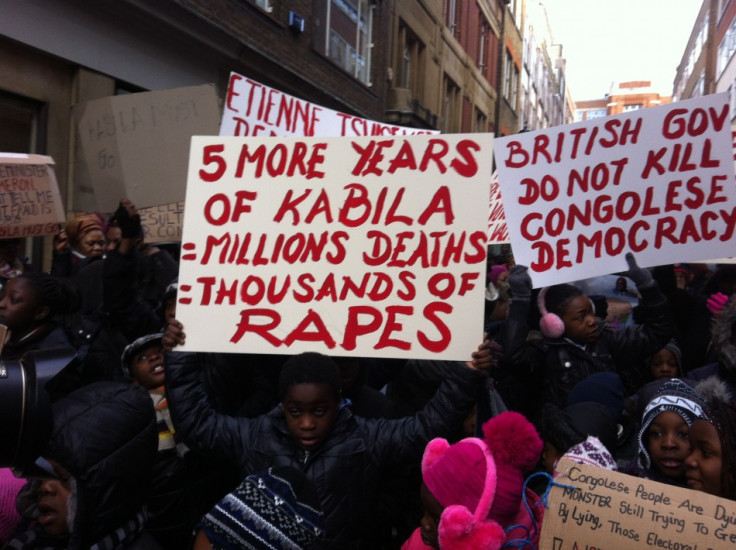 Signs held up by protesters at the rally