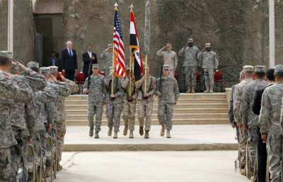U.S. soldiers carry Iraqi national flag and U.S. flag during ceremony to retire flags, marking end of the U.S. military engagement at Baghdad Diplomatic Support Center U.S. soldiers carry Iraqi national flag and U.S. flag during ceremony to retire flags, marking end of the U.S. military engagement at Baghdad Diplomatic Support Center