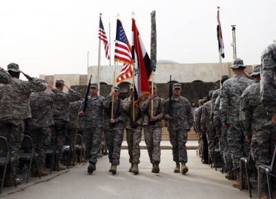 U.S. soldiers carry Iraqi national flag and U.S. flag during ceremony to retire flags, marking end of the U.S. military engagement at Baghdad Diplomatic Support Center U.S. soldiers carry Iraqi national flag and U.S. flag during ceremony to retire flags, marking end of the U.S. military engagement at Baghdad Diplomatic Support Center