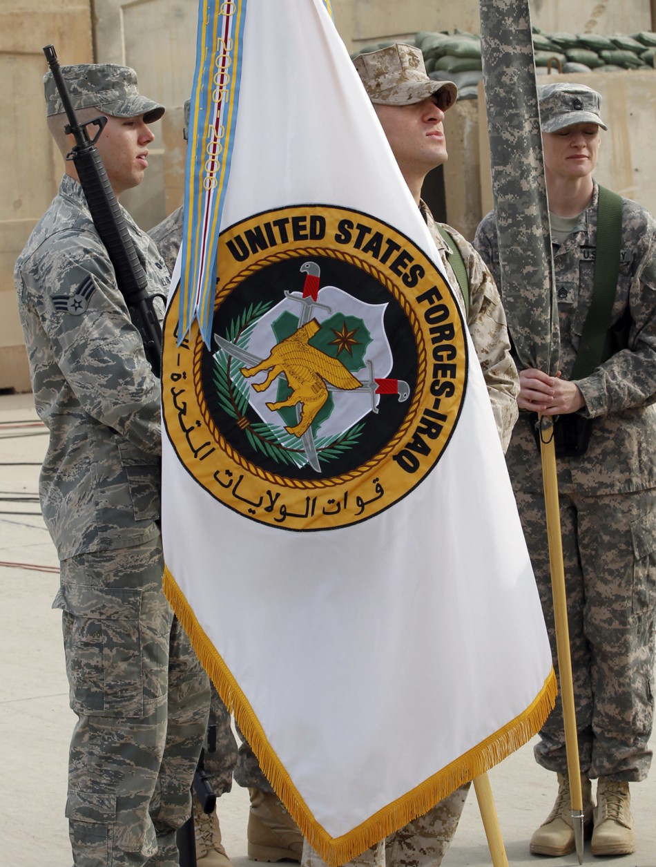 Commanding General of U.S. forces in Iraq, Lieutenant General Austin folds U.S. Forces in Iraq flag during ceremony marking end of U.S. military engagement at former U.S. Sather Air Base near Baghdad