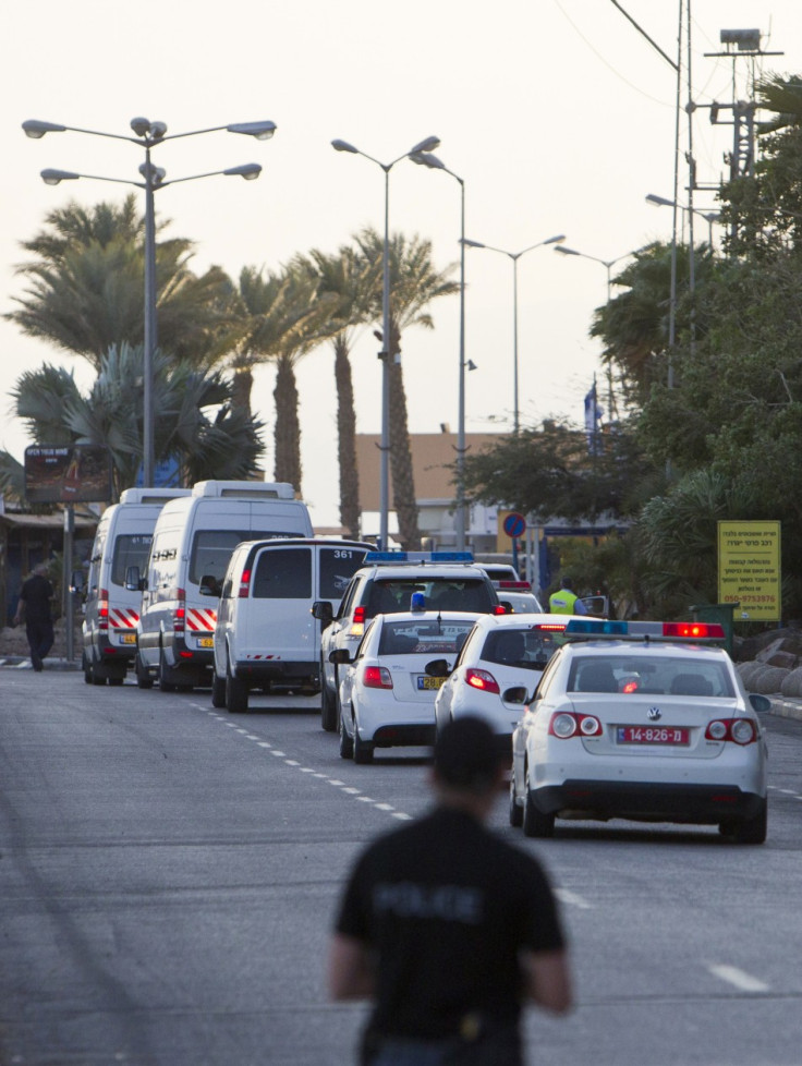 Israeli Prison Authority vehicles transporting Egyptian prisoners cross through the border crossing next to the Egyptian Red Sea resort of Taba