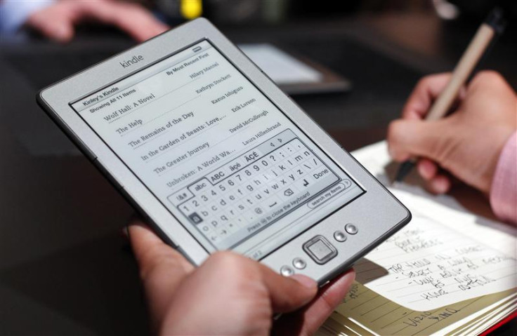 A reporter tries out a new $79 Kindle tablet at a news conference during the launch of Amazon's new tablets in New York.