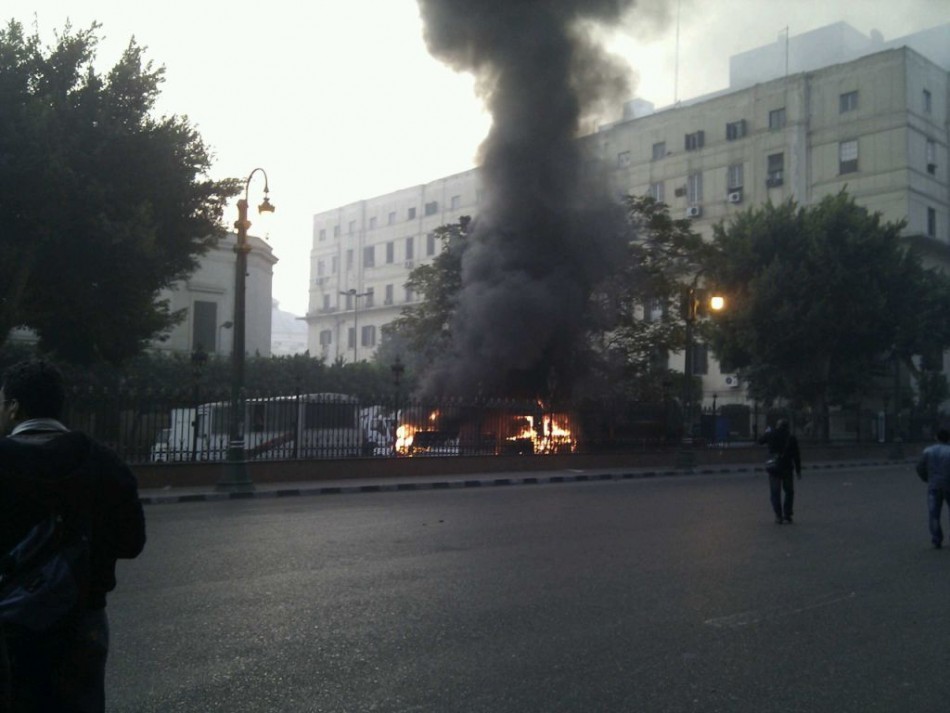 Cars are set on fire in front of the parliaments building