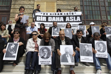 Human rights activists hold pictures of Armenian victims in front of the historical Haydarpasa station in Istanbul