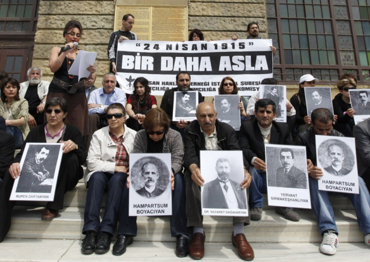 Human rights activists hold pictures of Armenian victims in front of the historical Haydarpasa station in Istanbul