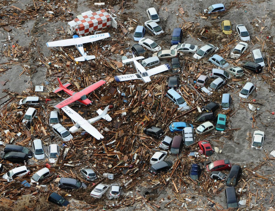 Cars and airplanes swept by a tsunami are pictured among debris at Sendai Airport, northeastern Japan March 11, 2011