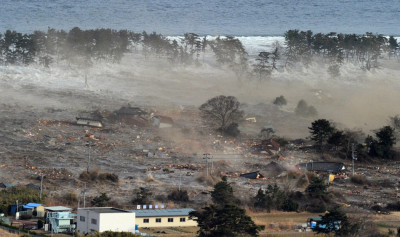 Houses are swept by a tsunami in Natori City in northeastern Japan March 11, 2011. Houses are swept by a tsunami in Natori City in northeastern Japan March 11, 2011.