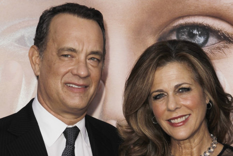 Cast member Tom Hanks (L) and his wife Rita Wilson arrive for the premiere of the film "Extremely Loud and Incredibly Close" in New York