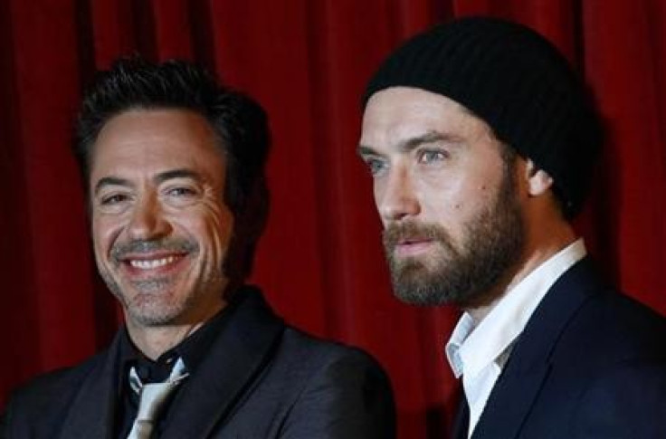 U.S. actor Robert Downey Jr. and British actor Jude Law pose for photographers at the premiere of &#039;&#039;Sherlock Holmes: A Game of Shadows&#039;&#039; at the Empire Cinema in London