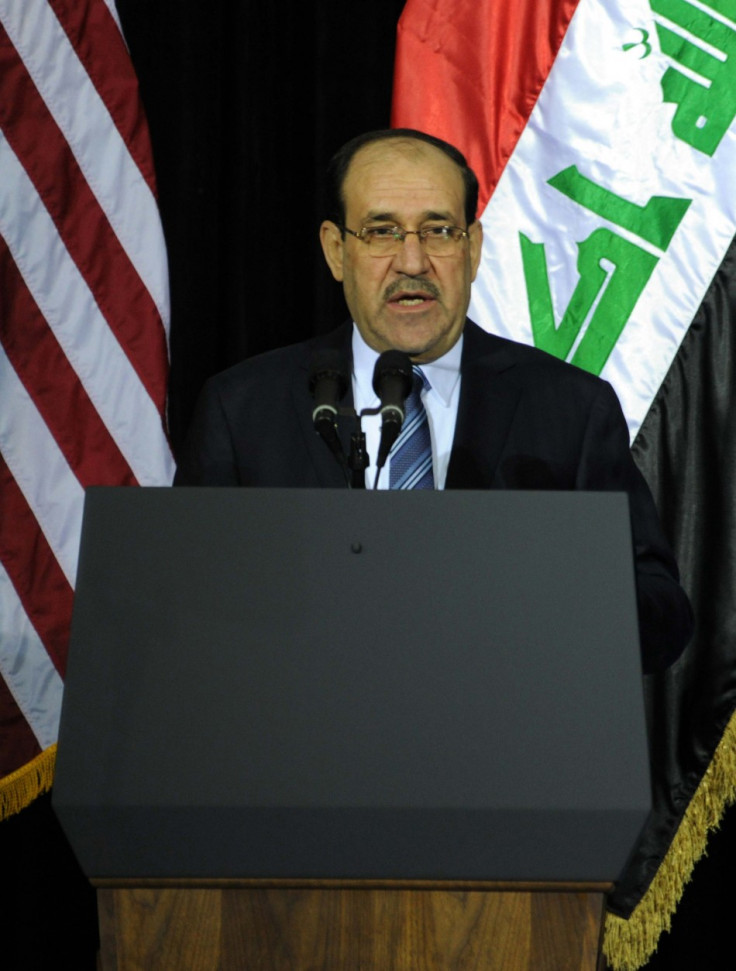 Iraq's PM al-Maliki speaks during one of several planned ceremonies to mark the end of American military presence in Iraq, in Baghdad