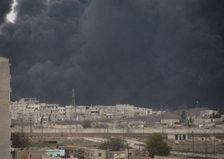 Black smoke is seen from Homs refinery
