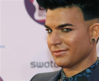 U.S. singer Adam Lambert poses on arrival on the red carpet at the MTV Europe Music Awards show in Belfast U.S. singer Adam Lambert poses on arrival on the red carpet at the MTV Europe Music Awards show in Belfast