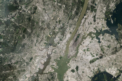 NASA satellite image shows sediment from Hurricane Irene rains and flooding emptying into New York Harbor from the Hudson River