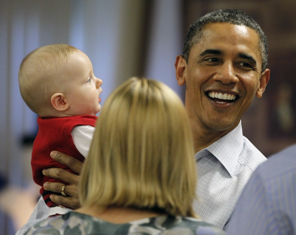 President Barack Obama with eight-month-old Cooper