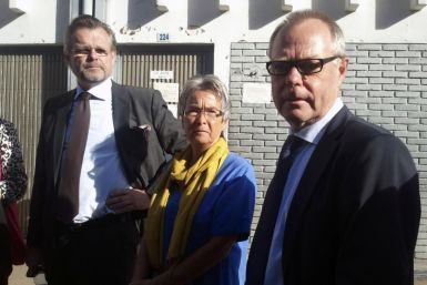 Parents of Swedish photographer Persson and Swedish ambassador to Ethiopia Odlander stand outside the courtroom in Ethiopia