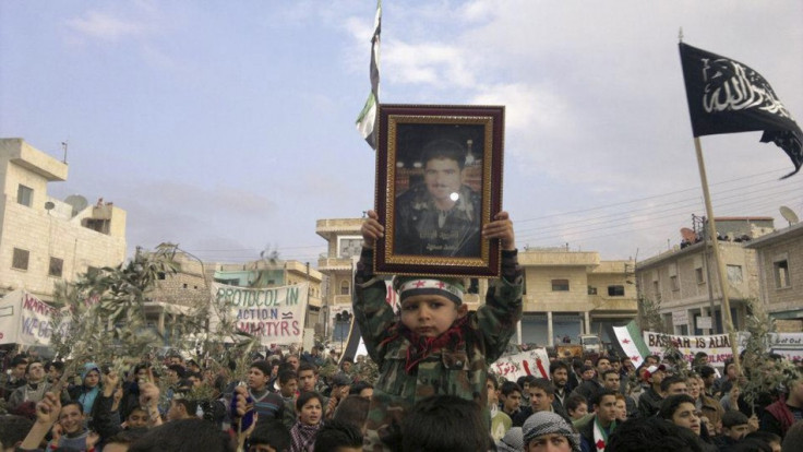 Demonstrators protest against Syria's President Assad after Friday prayers near Adlb