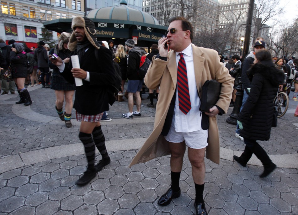 A man talks on his mobile during the 10th Annual No Pants Subway Ride in New York City