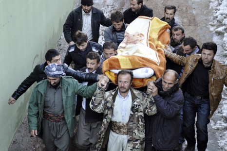 Locals carry a victim, killed in airstrikes, to the morgue of a hospital in Uludere, of the Sirnak province