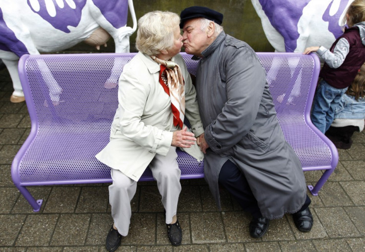 An Elderly Couple Kissing