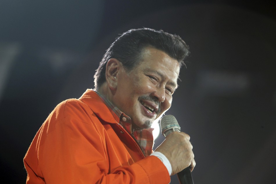 Philippine presidential candidate and ousted former president Joseph quotErapquot Estrada smiles at his final campaign rally at the University of Makati in Metro Manila