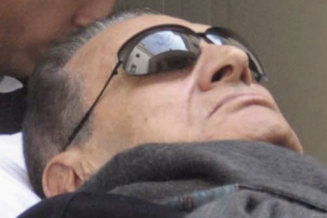 Former Egyptian President Mubarak Lies On A Gurney While Leaving The Courtroom