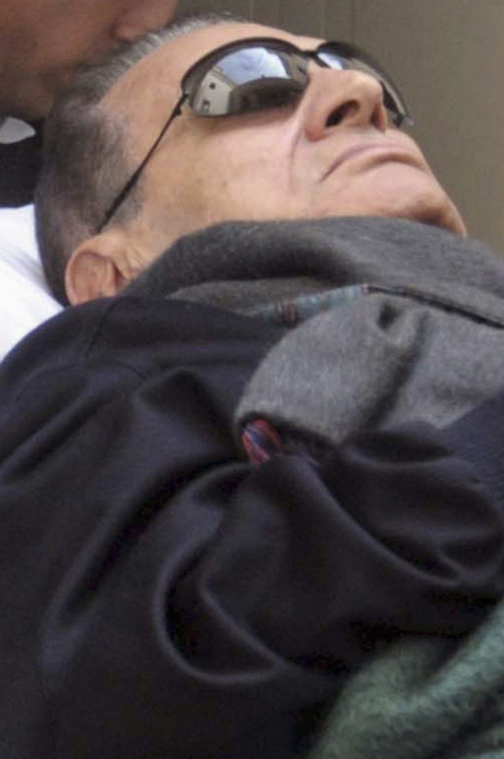 Former Egyptian President Mubarak Lies On A Gurney While Leaving The Courtroom