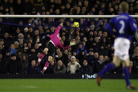 Everton&#039;s goalkeeper Tim Howard (unseen) scores past Bolton Wanderers&#039; Adam Bogdan