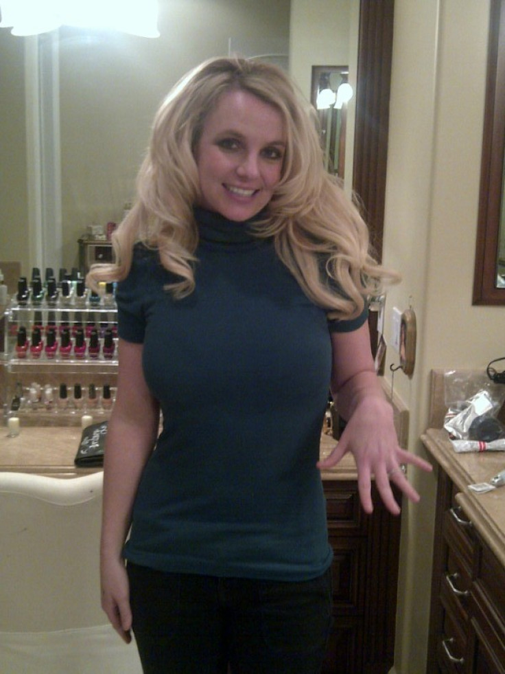 Britney Spears flashes the engagement ring that she received from fiance Jason Trawick, who is due to become her third husband