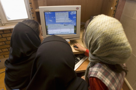 Iranian schoolgirls chat online at an internet cafe