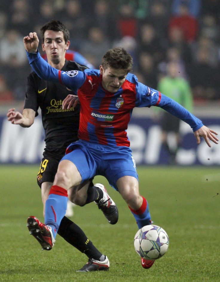 Barcelona&#039;s Cuenca is challenged by Pilar of Viktoria Plzen during their Champions League Group H soccer match in Prague