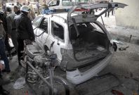 A car is damaged after an explosion in the Maidan district of Damascus