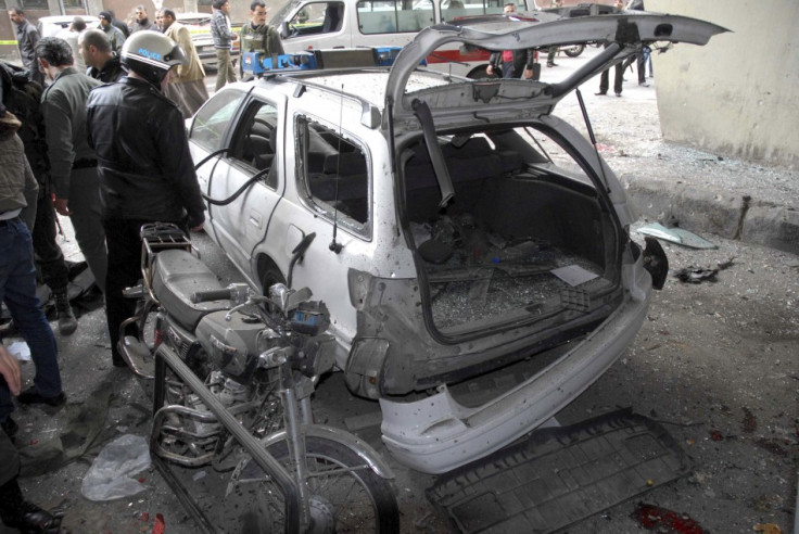 A car is damaged after an explosion in the Maidan district of Damascus